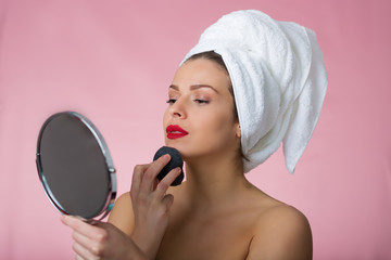 Beautiful woman removing makeup