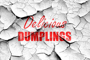 Grunge cracked Delicious dumplings sign