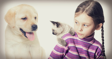 Child and kitten and puppy