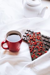 Composition of chocolate, teapot and mug