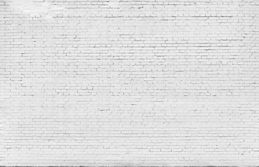 Brick wall painted with white paint.