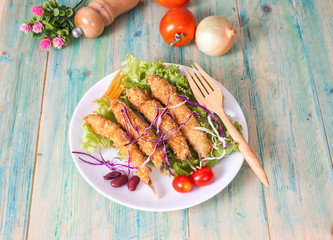 Fish fry in plate on wood desk