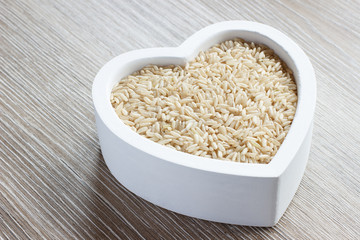 Heart filled with brown rice