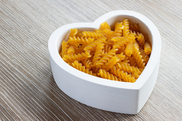 Heart filled with fusilli pasta