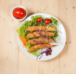 Fish fry in plate on wood desk