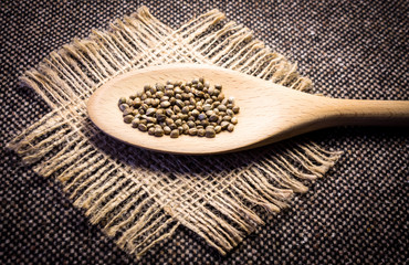 Hemp (cannabis) seeds in wooden spoon