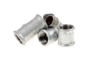 Galvanized plumbing parts on an isolated white background
