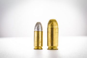 cartridges of 11mm and 9mm pistols ammo, Size does matter concept