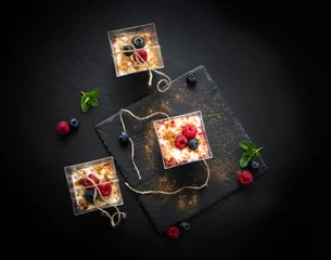 Fototapeten glass dessert with yogurt cream and red fruits © TTLmedia