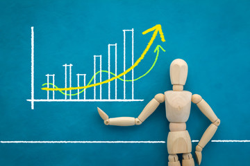 wood man figure presenting drawing of graph analysis.jpg