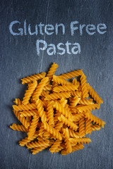 Gluten free pasta on dark stone background
