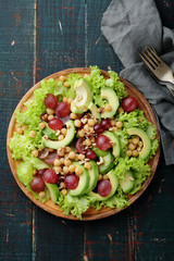 plate with green avocado salad