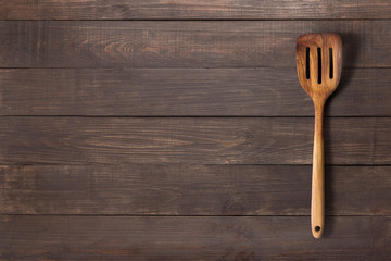 Spatula on the wooden background for you text