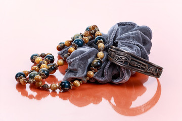 Necklace, bracelet and hair elastic on pumpkin background