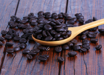 Coffee beans on the wooden floor