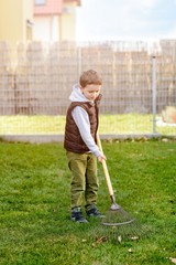 Small boy helping in the garden.