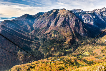 Fototapeta premium Ropeway Cable transport wires and cables leading to the valley
