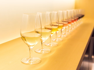 Different color wine on a shelf