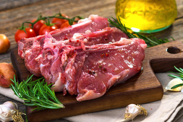 Raw veal steak  on wooden background
