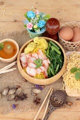 Egg noodles with pork and dumpling in soup.