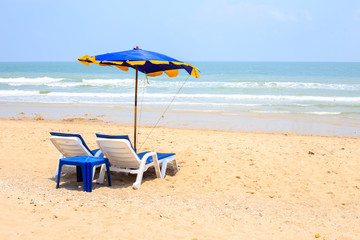 Parasol and beach chairs.