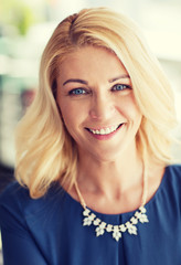 Fototapeta premium happy smiling blonde woman in blue clothes