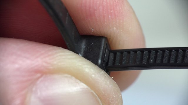 Locking Cable Tie Macro. 4K UltraHD video.