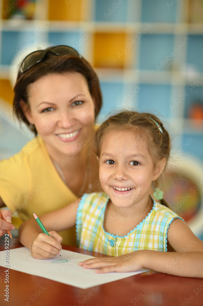 Poster girl painting with mother