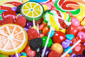 multicolored lollipops, candy and chewing gum