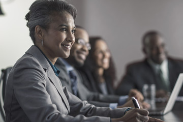 Businesswoman smiling in meeting