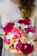 the bride holding a wedding bouquet