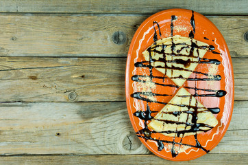 Pancake with chocolate cream and biscuit crumbs