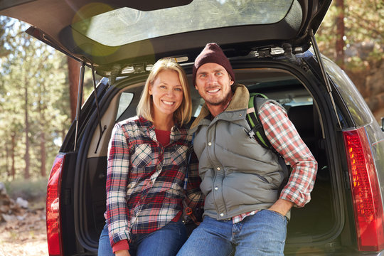 Portrait of a couple by their car before hiking, California