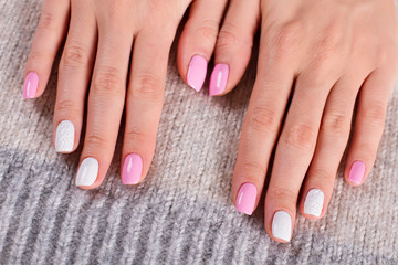White-pink women's manicure.
