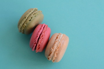 french colorful macarons on blue background