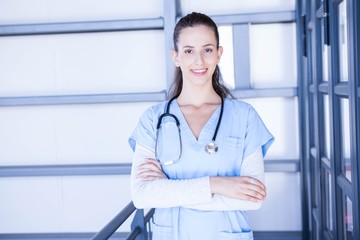 Female doctor standing with arms crossed