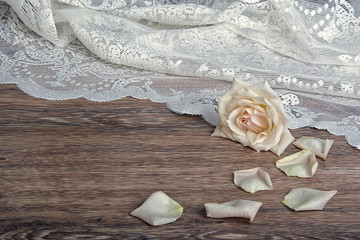 fabric and rose on the wooden table