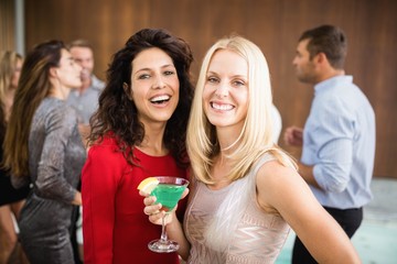 Portrait of beautiful women having drinks