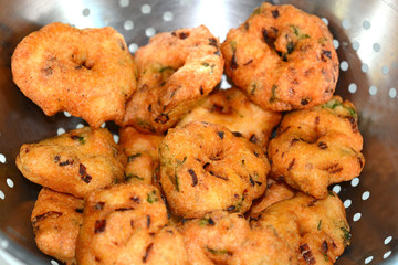 Vada is a popular dish in Southern India. Vada is made of rice and lentil and fried in oil.