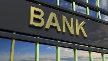 Bank building sign closeup, with sky reflecting in the glass.