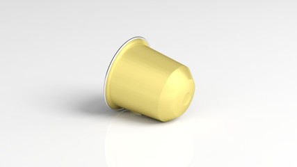 Golden coffee capsule, isolated on white background.