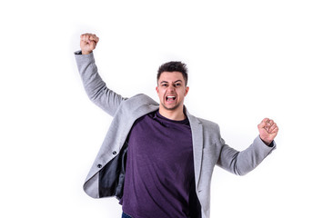 young business man with raised arms yelling celebrating victory