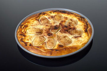 Pear pie on black background