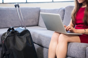 Close-up of business woman using laptop