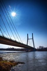 Warsaw Siekierkowski bridge in the glare of sunlight
