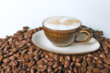 Close up coffee cup and beans on a white background