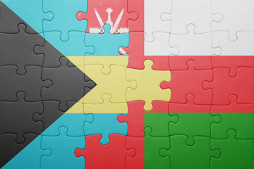 Fototapeta premium puzzle with the national flag of bahamas and oman