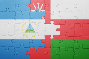puzzle with the national flag of nicaragua and oman