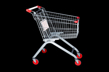 Shopping cart in marketing shop isolated on black background