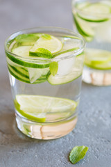 Infused water with cucumber lime and mint in a glass